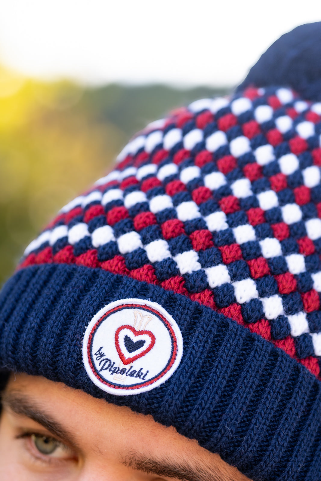 Bonnet pompom marine à carreaux