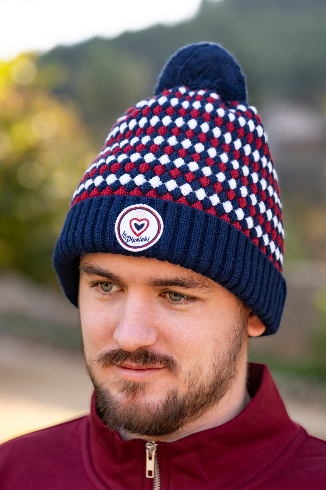 Bonnet pompom marine à carreaux