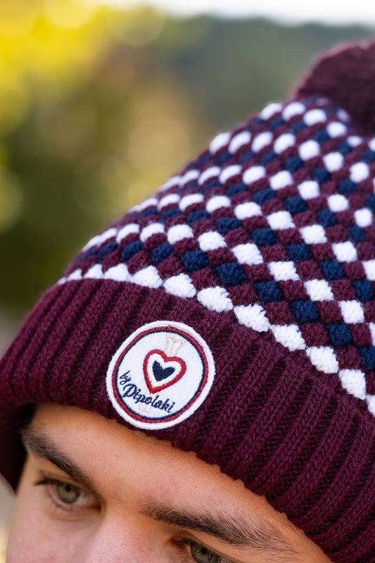 Bonnet pompom bordeaux à carreaux